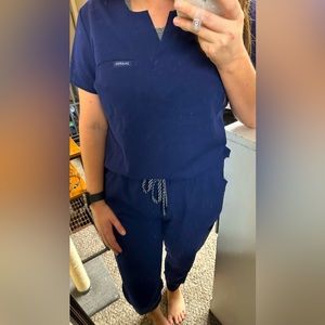 jaanuu navy one-pocket tuck-in scrub top